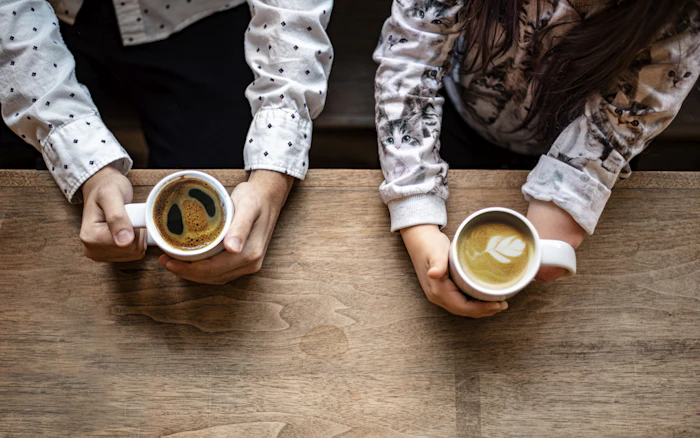 Friends sharing coffee at a table