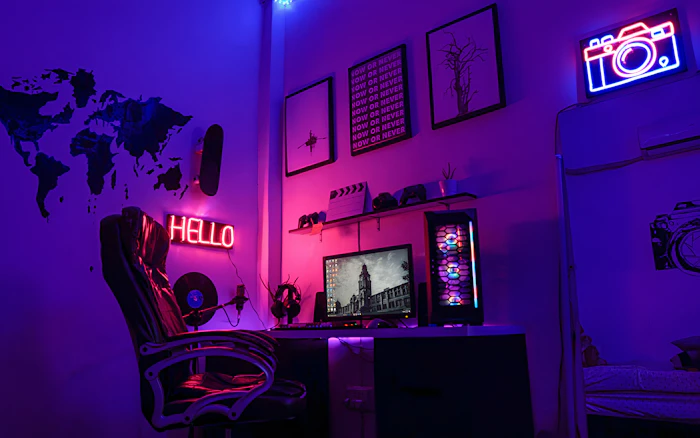 Gaming and music workspace with purple lighting