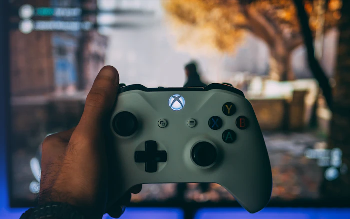 Xbox controller in front of a gaming screen